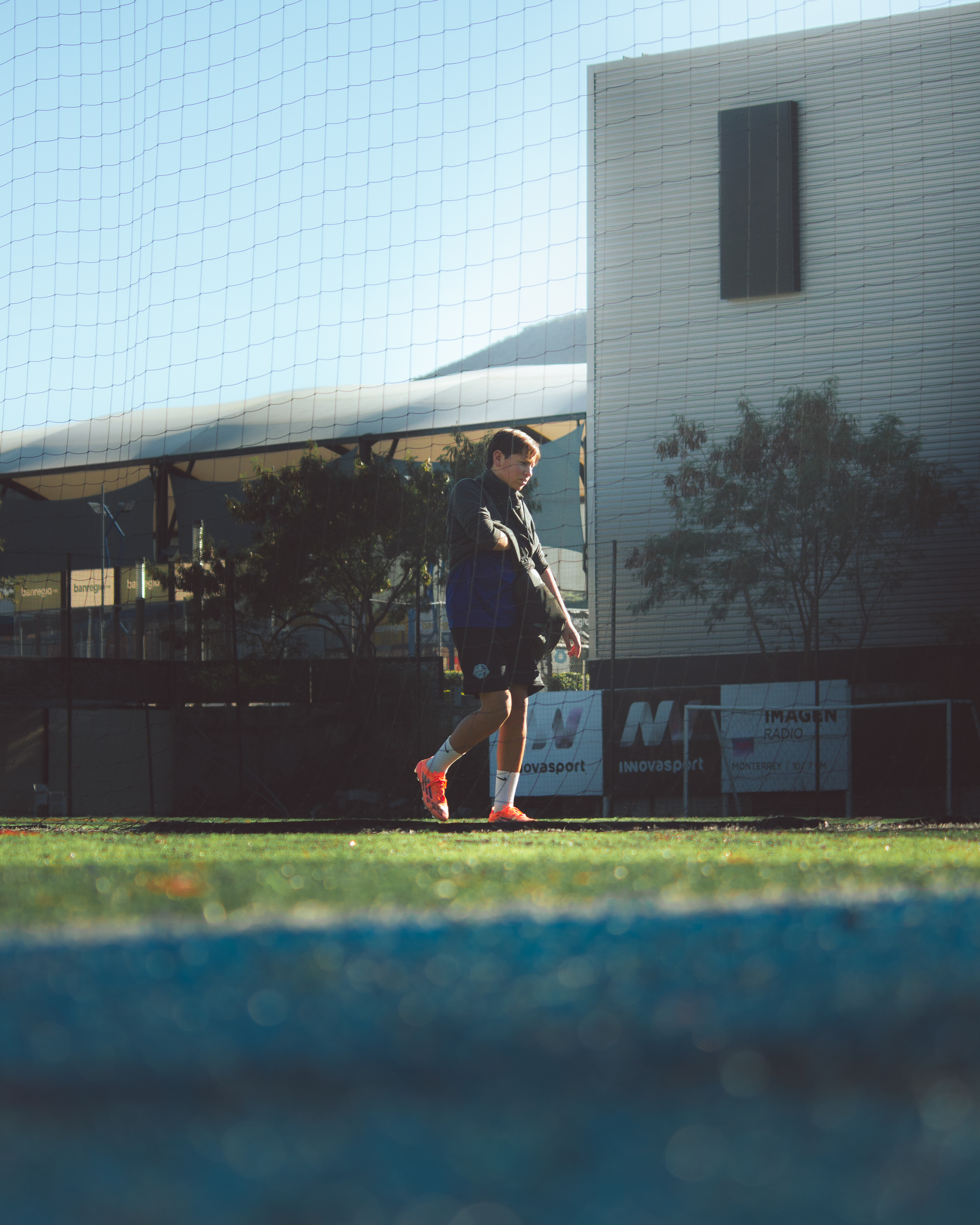 Dramatic low angle shot of a sprinter exploding from starting blocks